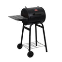 Black Patio Pro barrel-style barbecue grill on a white background. Angled to show off left side shelf and 2 wheels on the left cart legs.
