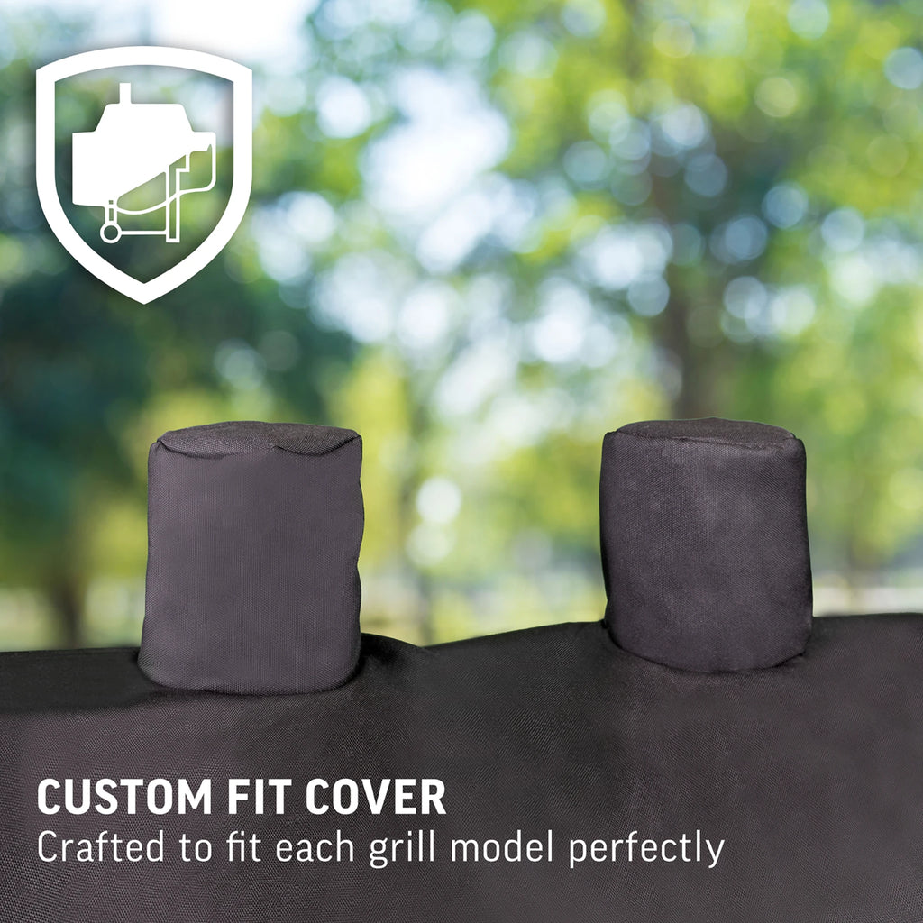 Closeup of 2 chimney stack covers at the top of a grill cover with the text Custom fit cover crafted to fit each grill model perfectly.