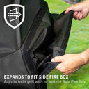 Close-up of the right side of the cover where someone uses both hands to separate the velcro attachment to open the side fire box cover. Text reads: Expands to fit side fire box. Adjust to fit grill with or without side fire box.