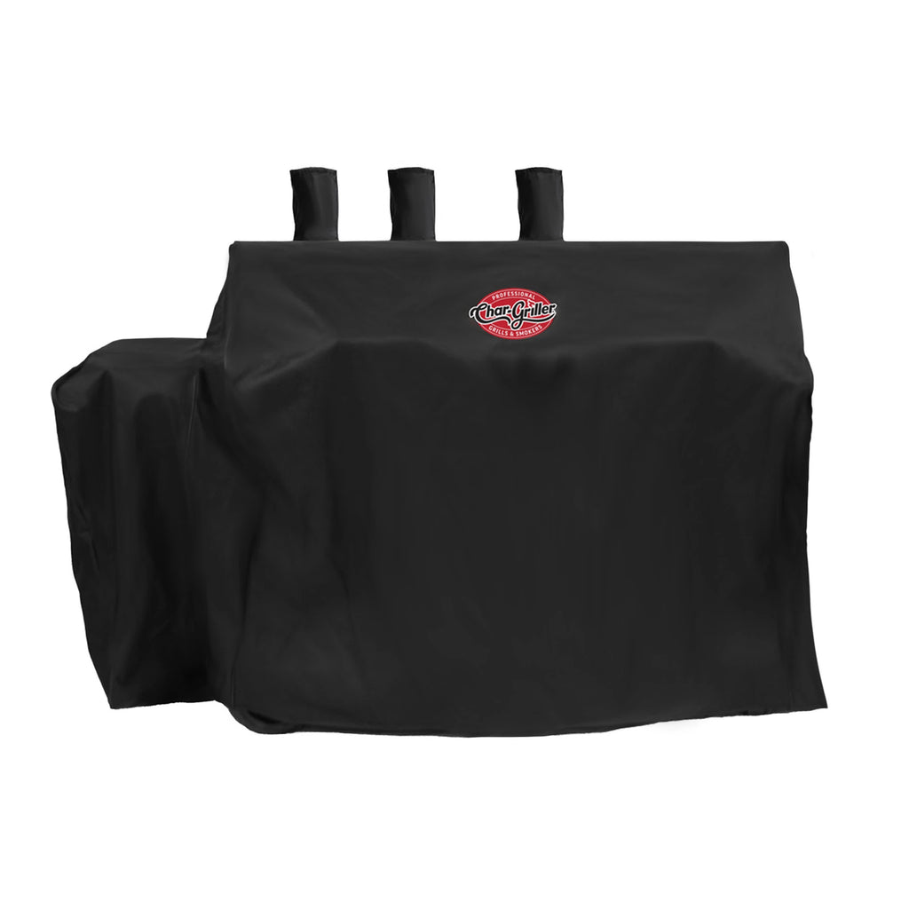 The cover installed on a barrel grill and offset smoker with 3 chimneys. Cover includes room for a side shelf on the left. The expandable side fire box cover on the right is folded in so the right side is straight from top to bottom.