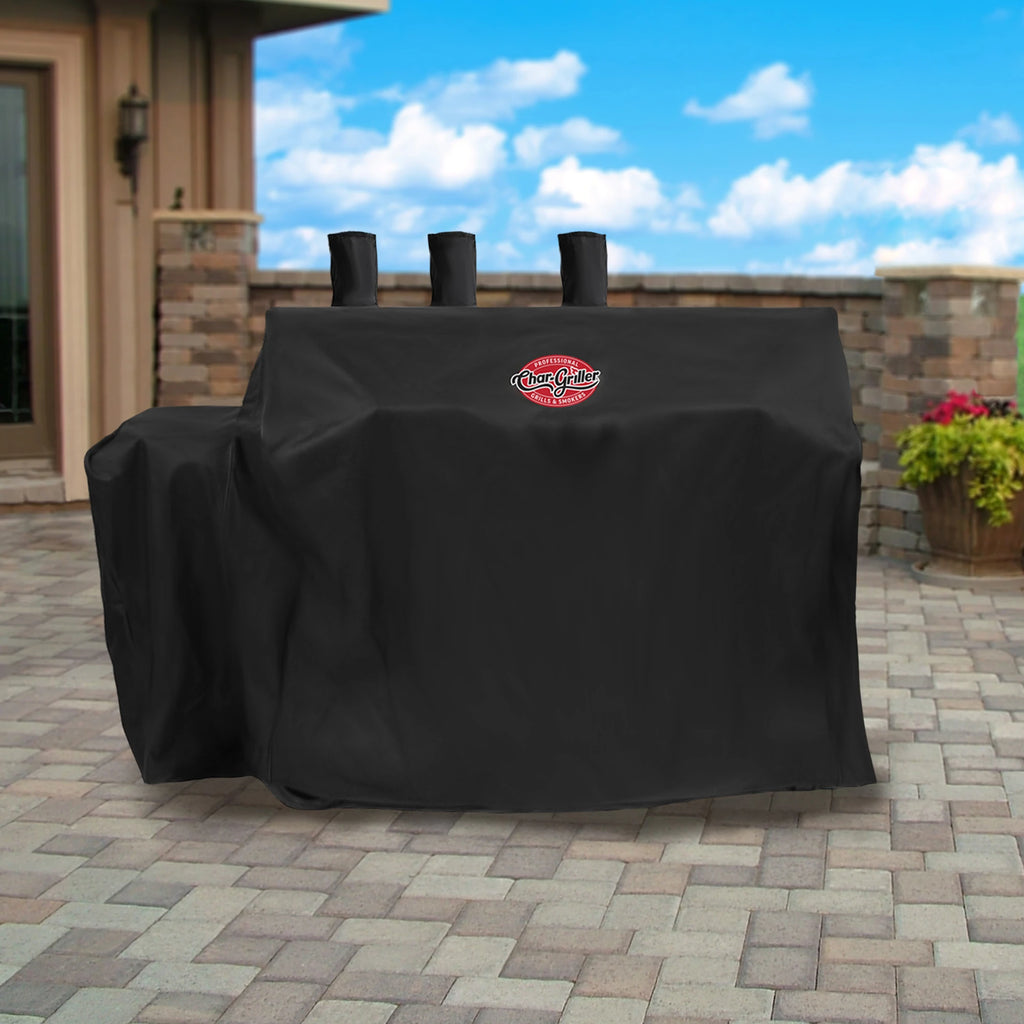 Covered grill without a side fire box outside on a brick patio.