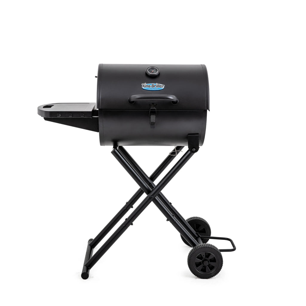 Black portable Gambler grill on collapsible wheeled cart.