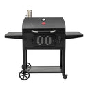Front view of black Classic Cart Style Charcoal Grill on white background. Side shelves are up. Steel chimney is in left rear. Grill is mounted on a cart with 2 large wheels (left), 2 small locking casters (right), and a perforated metal shelf between the legs.