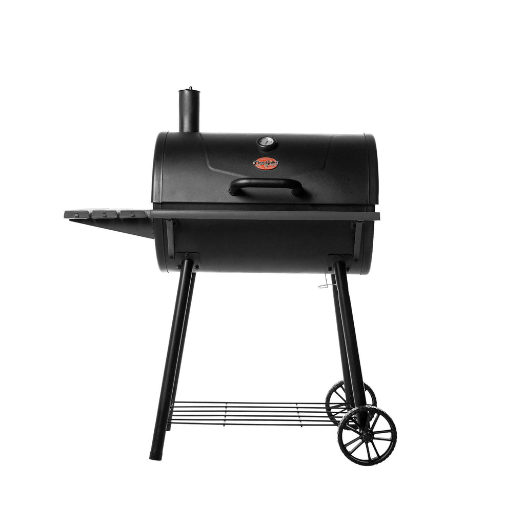 Black Super Pro barrel grill on a white background. The grill has a side shelf on the left and a chimney in the left rear of the lid. The lid has a built-in temperature gauge, a Char-Griller logo plate just below it, and a curved handle below the logo plate. The grill is on a cart with 2 wheels on the right side and a wire shelf between the legs.
