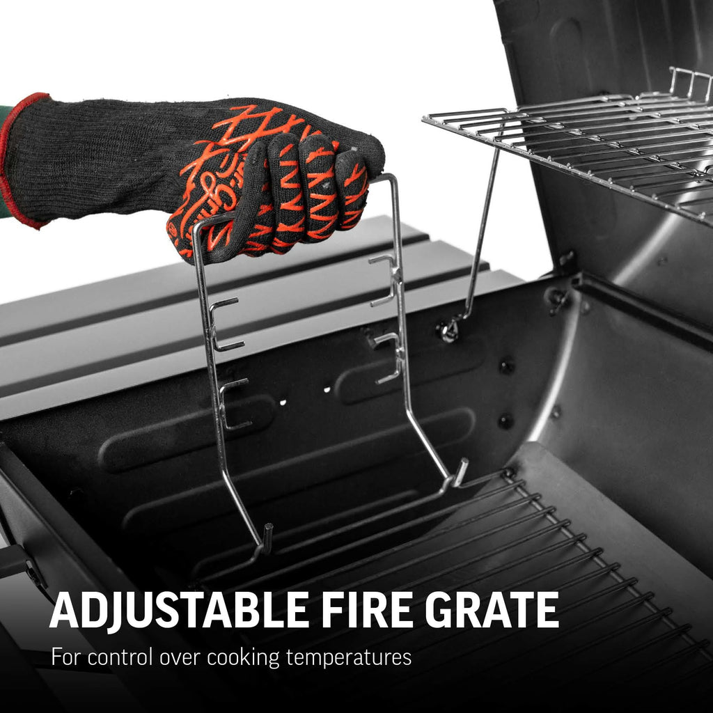Someone wearing Char-griller grill glove adjusts the fire grate in a Super Pro grill. Text reads: 'Adjustable Fire Grate for control over cooking temperatures.