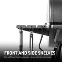 Closeup of the side shelf, which is made of 3 slats running front to back. A utensil hook is built into the end of each slat, shown here with utensils hanging from them. Text reads: Front and side shelves for additional food preparation space and utensil storage.