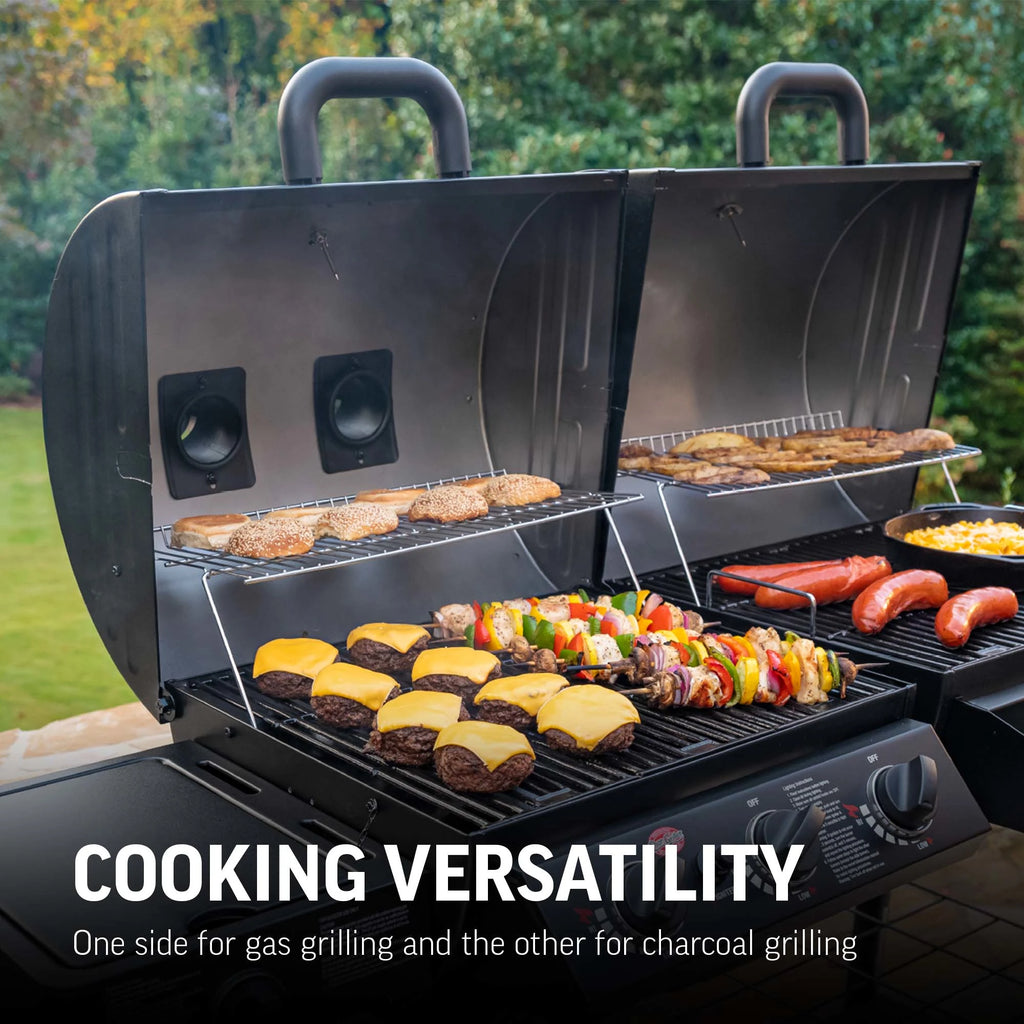 A fully loaded Texas Trio with both grill half lids open to show cheeseburgers, mixed vegetable and meat skewers, and hamburger buns cooking on the gas side. The charcoal side is cooking smoked sausages, a cast iron pan  of mac and cheese, and home fries. Text overlay reads: Cooking versatility. One side for gas grilling and the other for charcoal grilling.