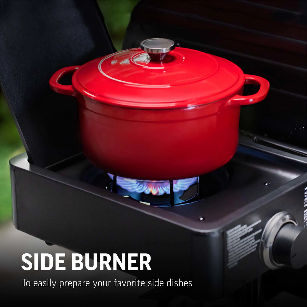 A red Dutch oven sitting on the lit side burner of a Texas Trio grill. Text overlay read: Side burner to easily prepare your favorite side dishes