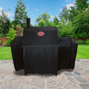 Covered Pro Deluxe grill with side fire box sitting on  an outdoor patio.