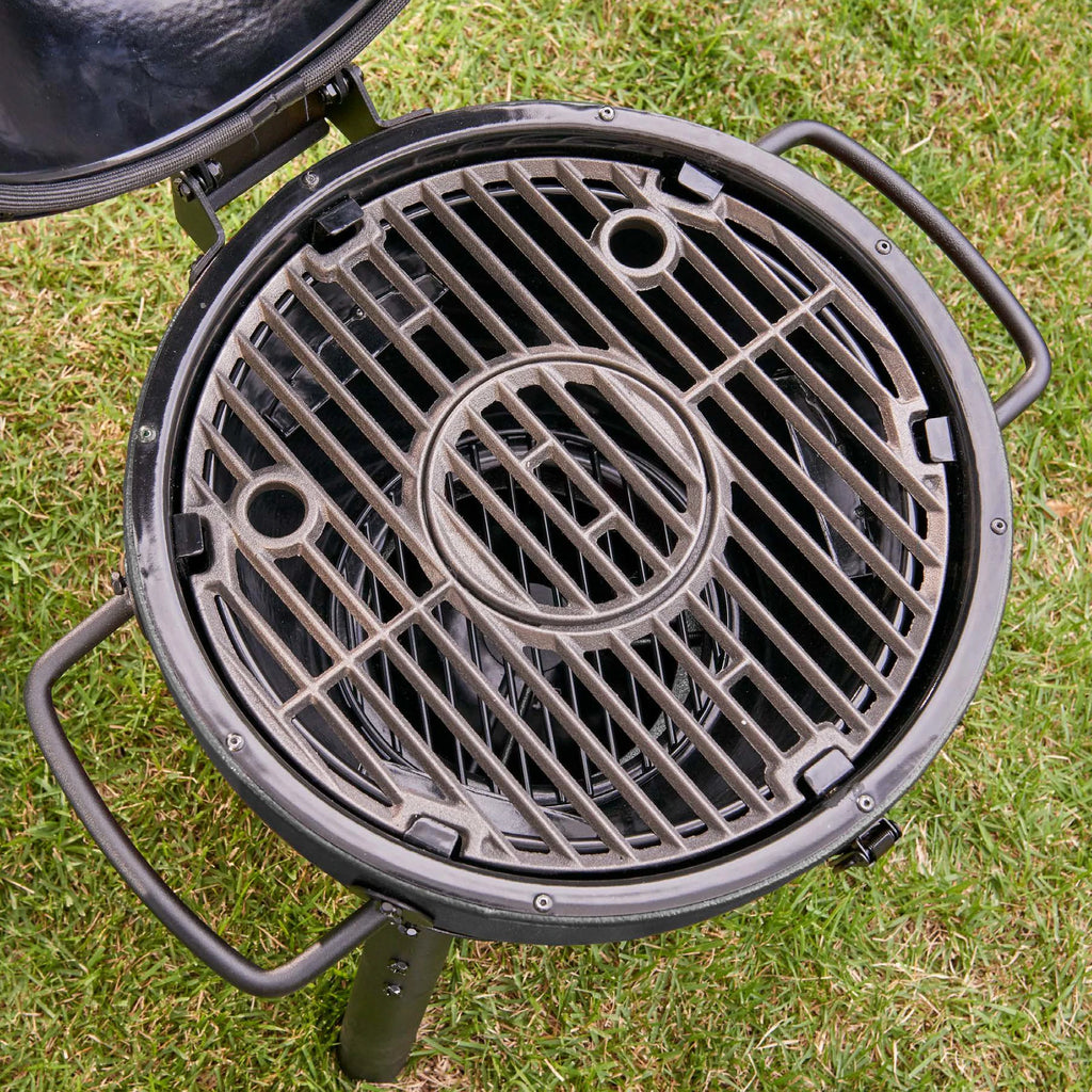 Closeup of the 2 cooking grates, seen from the top so the charcoal fire grate can be seen below them.