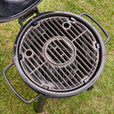 Closeup of the 2 cooking grates, seen from the top so the charcoal fire grate can be seen below them.
