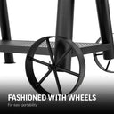 Closeup of the larger wheels on the right side of the grill cart. Text reads: Fashioned with wheels for easy portability.