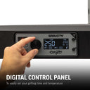 Digital control panel on a grill with a hand adjusting settings, featuring the Gravity Char-Griller brand. Text overlay reads: Digital Control Panel to easily set your grilling time and temperature