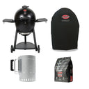 Black Char-Griller AKORN kamado grill with a matching black grill cover, a trigger-release charcoal chimney, and a bag of Lump Charcoal on a white background.