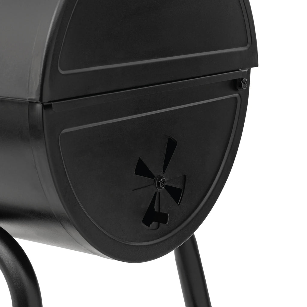 Closeup of the bottom of the right side of the grill. A circular adjustable damper in the bottom grill bottom is partly open.