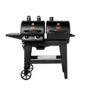 Dual Threat 2-Burner Gas & Charcoal Grill. The gas grill is on the left and the charcoal grill is on the right. The grill has a side shelf on the left and is mounted on a cart with 2 wheels on the left.