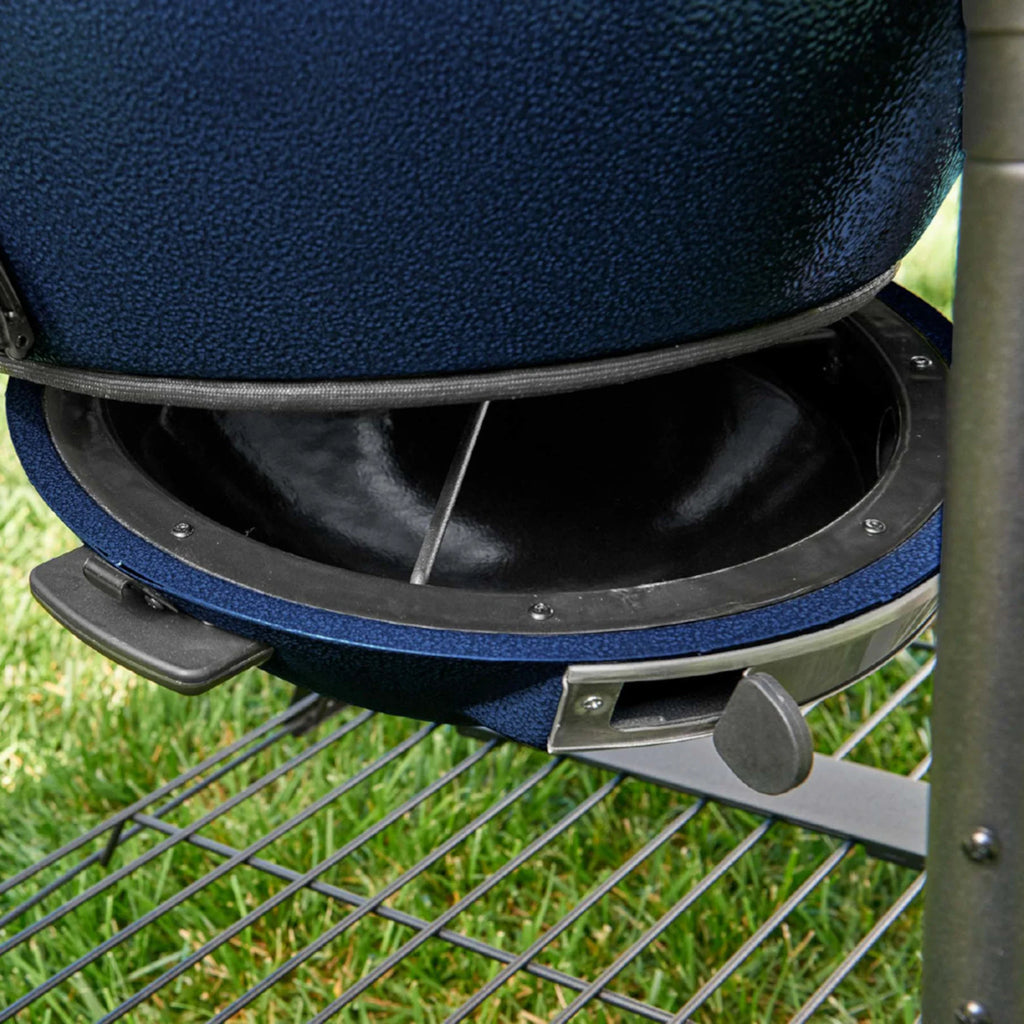 Close-up of the EasyDump ash pan open to reveal a black interior.
