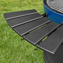 Close-up of the black side shelf mounted on a sapphire AKORN grill