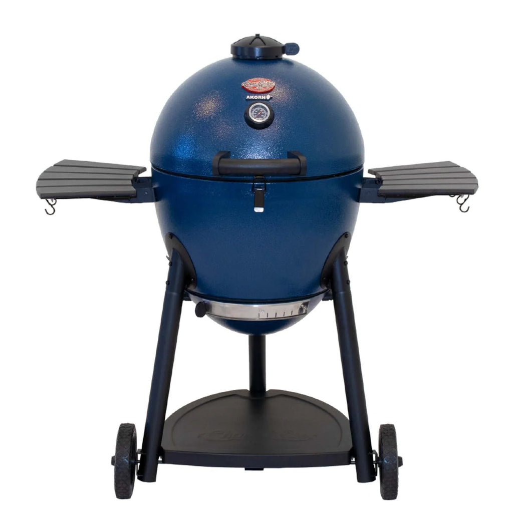 A sapphire blue AKORN kamado grill with a black cart and side shelves, shown against a plain white background.