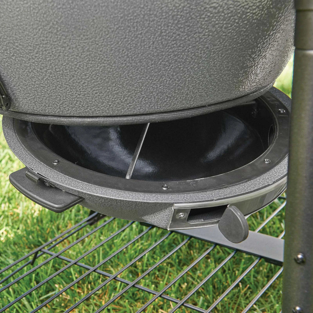 Close-up of the EasyDump ash pan open to reveal a black interior.