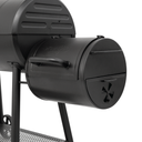 A closeup of the offset smoker box mounted on the base of the barrel grill. The offset smoker has it's own lid and damper. There is a handle on the smoker box for raising the right side of the grill to move it.