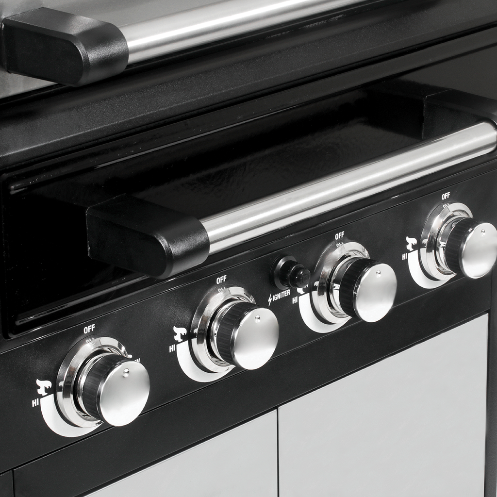 Closeup of the Flavor Drawer handle above 4 burner control knobs. There is a push-button ignitor between the center knobs.